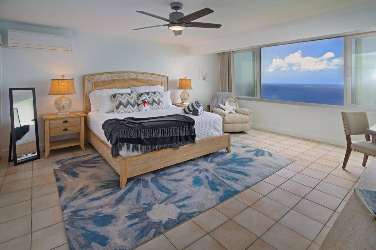 Spacious bedroom with king bed and panoramic views
