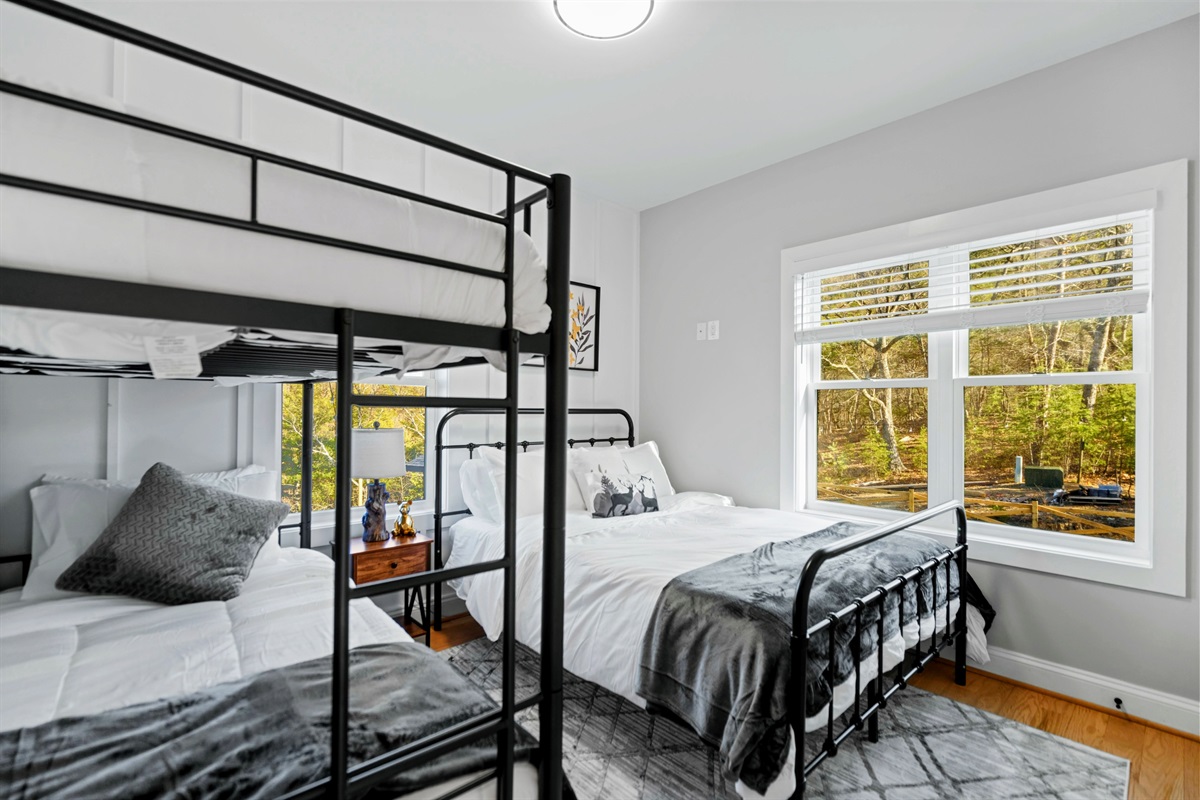 Bunk Up in Style – With cozy beds and beautiful forest views, this room is designed for making memories with loved ones.