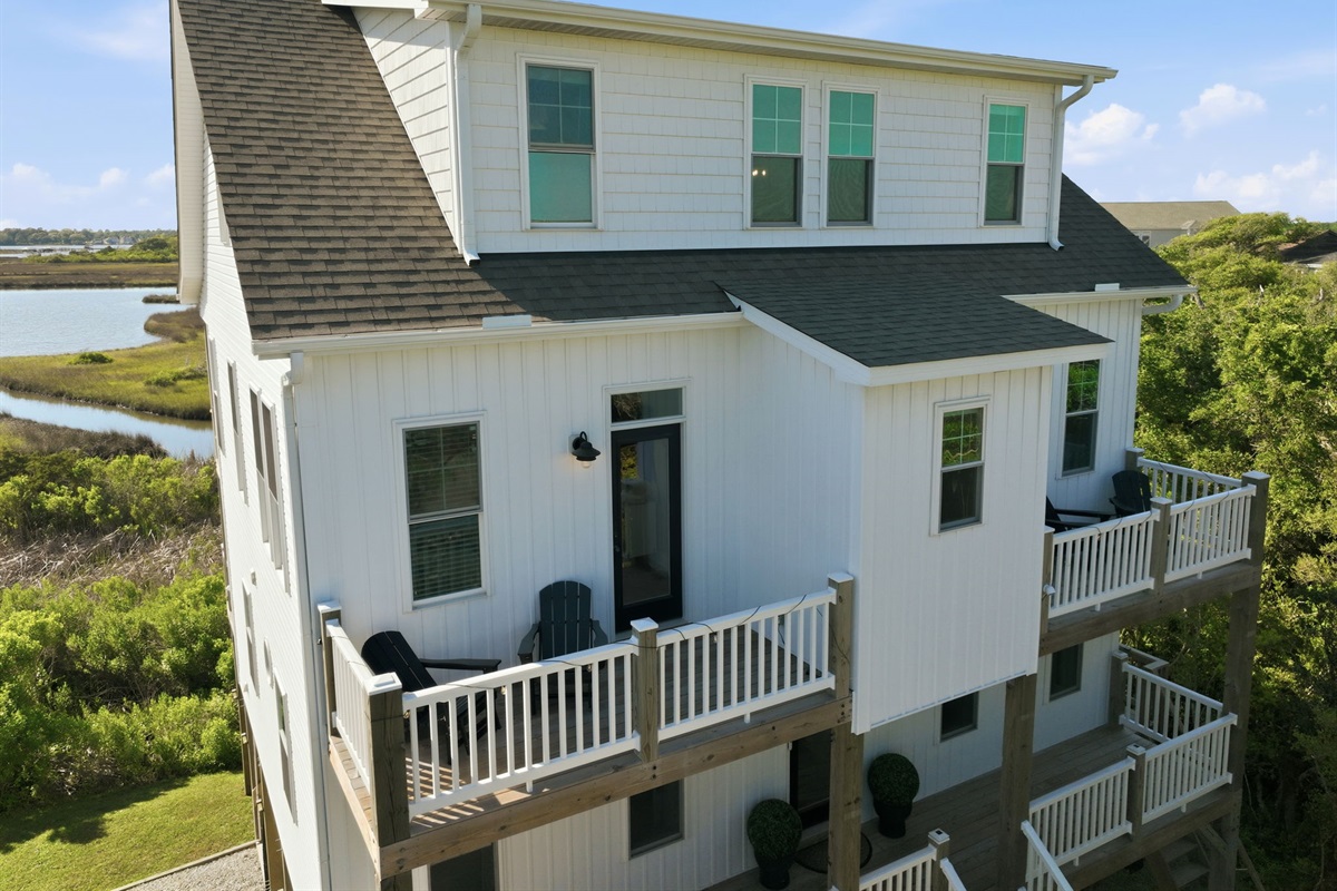 Wake up to beautiful marsh views from nearly every level of the home