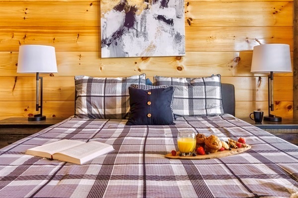 Spacious master bedroom with a plush mattress, cozy bedding, Roku TVD, and ample storage. Perfect for unwinding after a day of adventure.