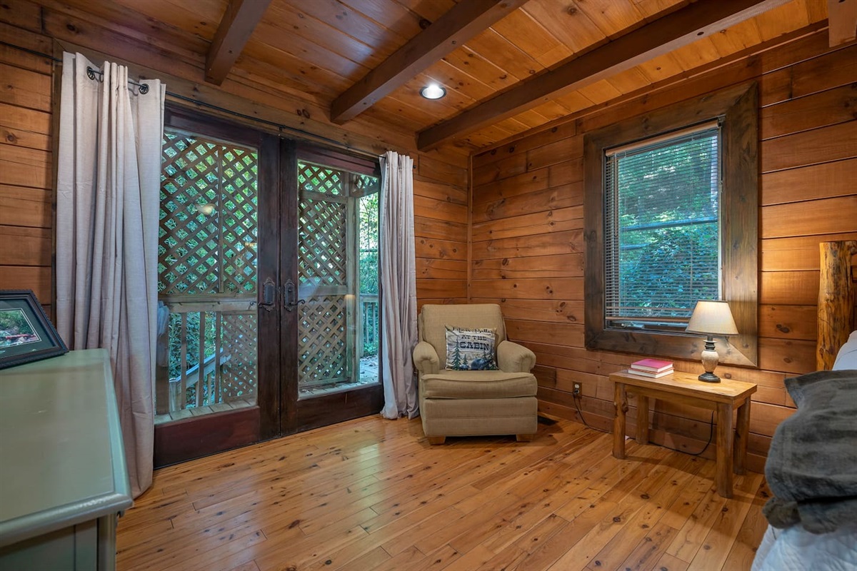 Master bdrm 2, on main level with French Doors out to wrap around, fully enclosed and covered deck