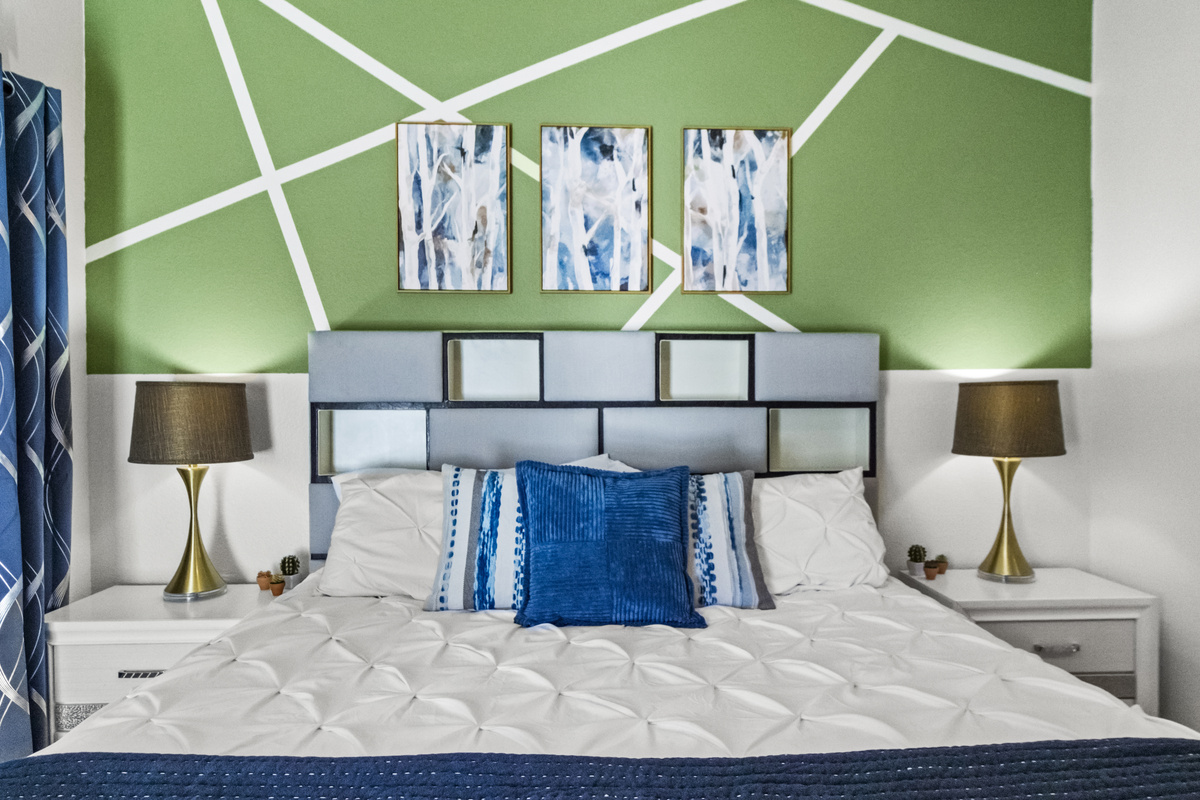 Another calming bed space for guests that features a Roku Smart TV, windows, and a comfortable hybrid mattress. 