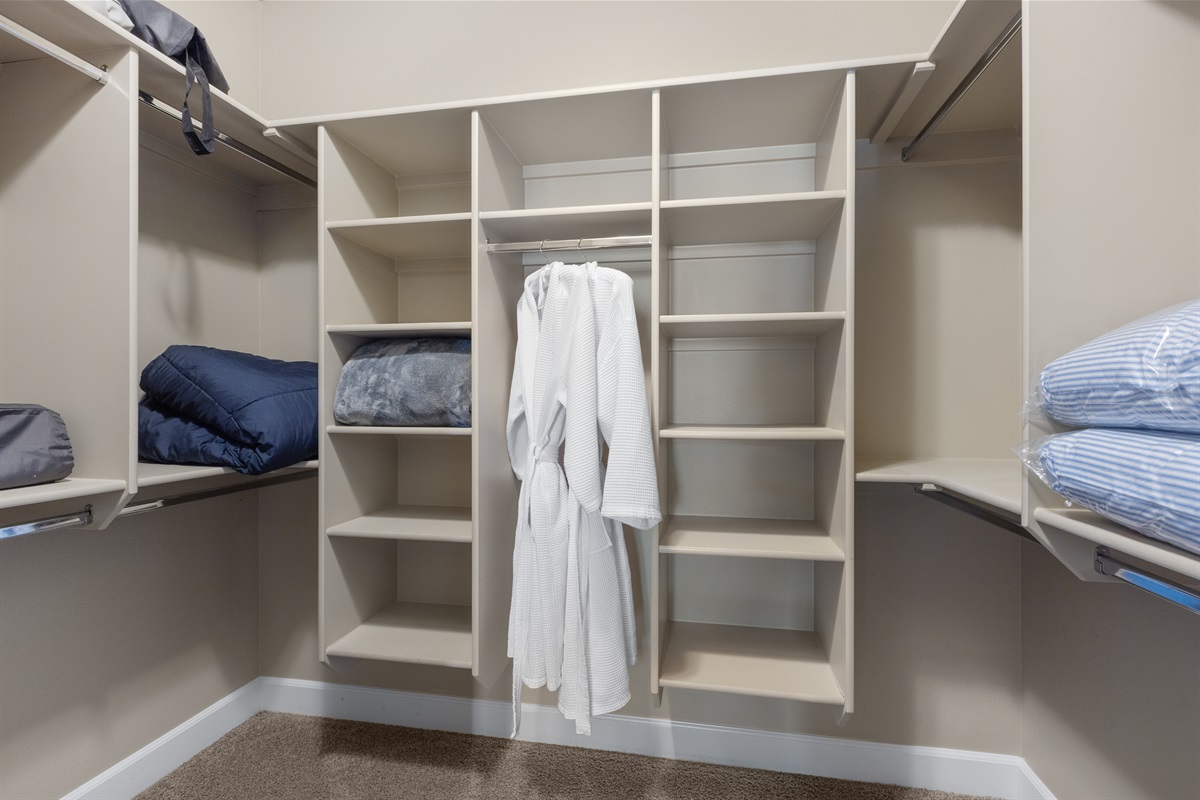 Walk-in closet with plenty of storage for longer stays.