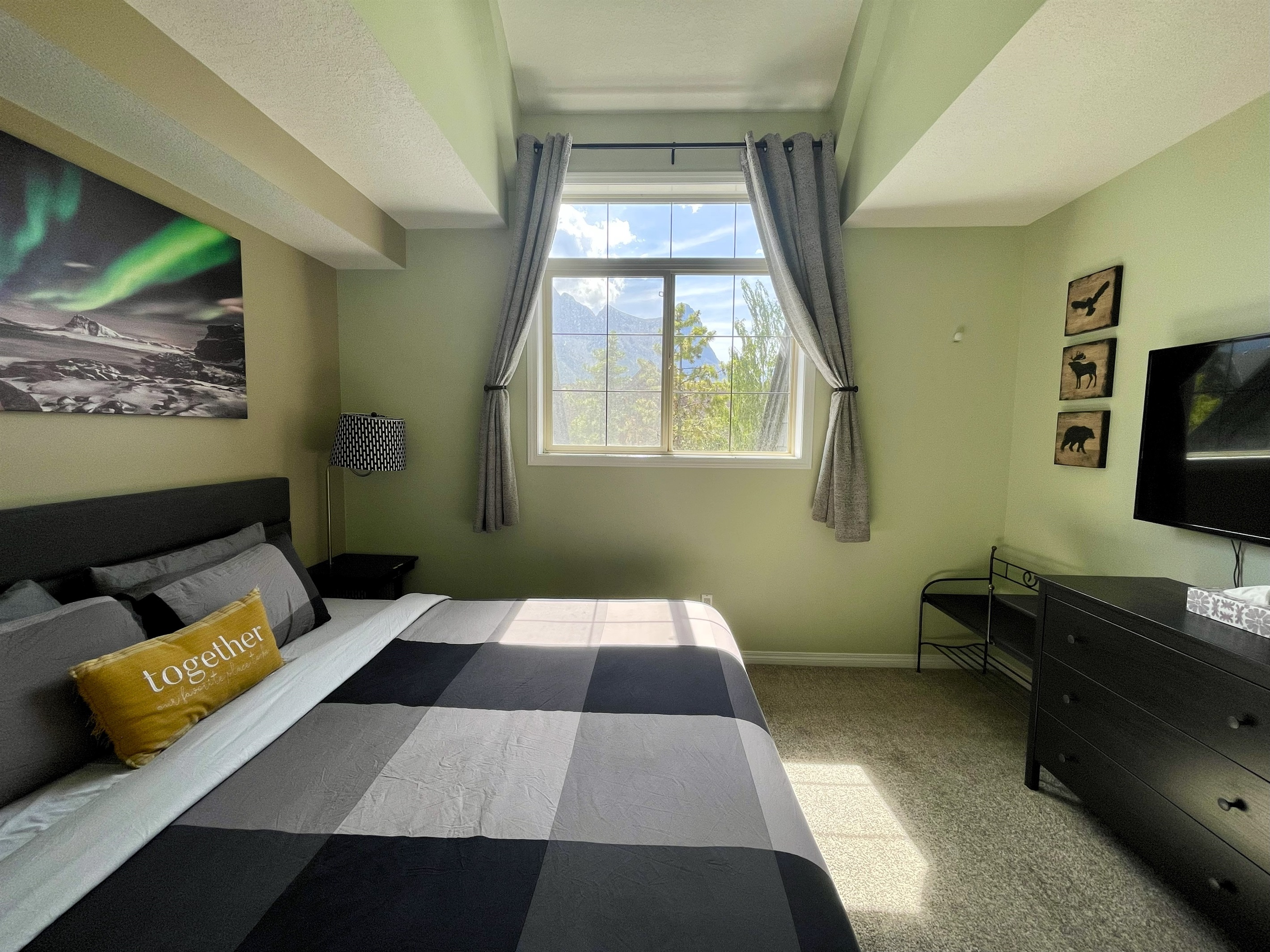 Master Bedroom with ensuite bathroom.  Located on the 2nd floor. TV & closet.  Check out the view from the window!