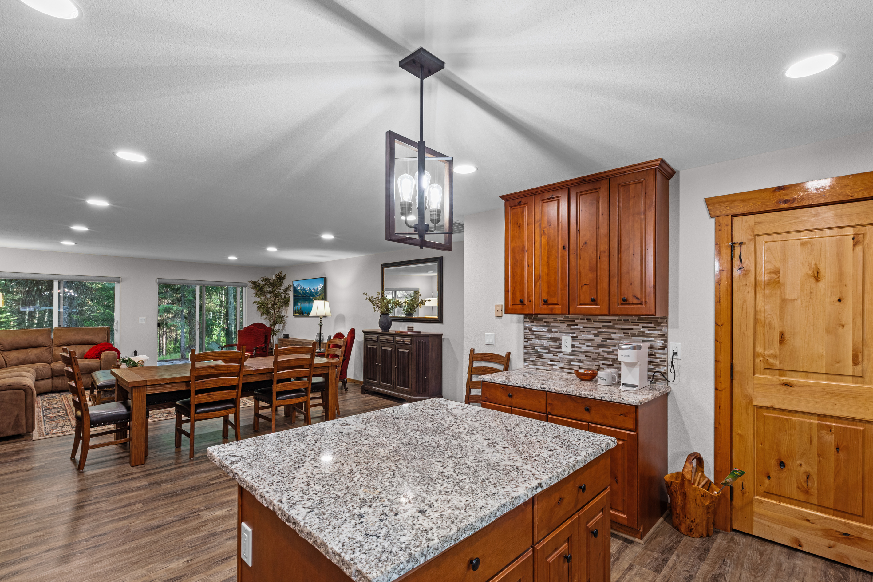Kitchen with oven, island and refrigerator