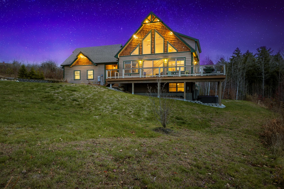 Enjoy the inviting lodge exterior framed by breathtaking mountain scenery.
