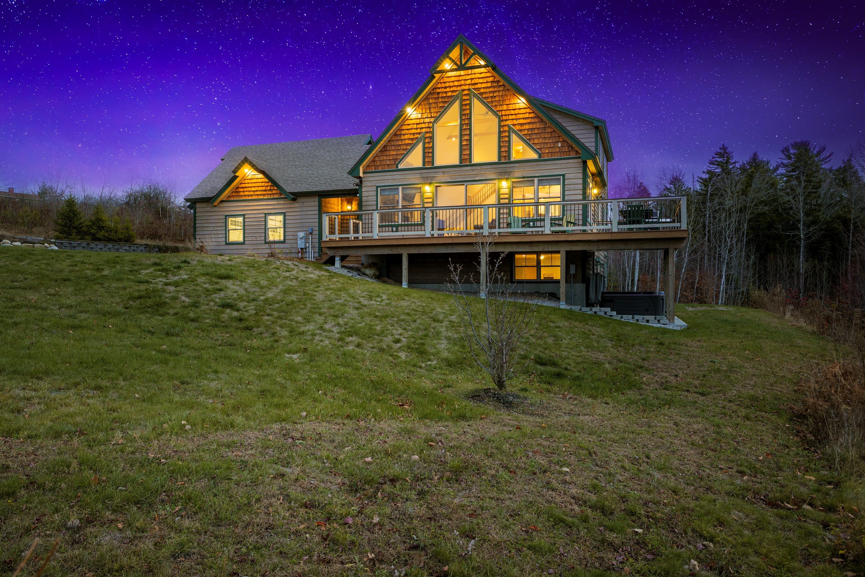 Enjoy the inviting lodge exterior framed by breathtaking mountain scenery.