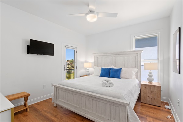 The left side back bedroom boast the 4th bedroom with a King bed