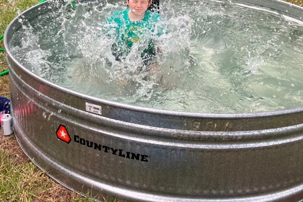 The kids will enjoy splashing in the Cowboy Stock Tank Pool!