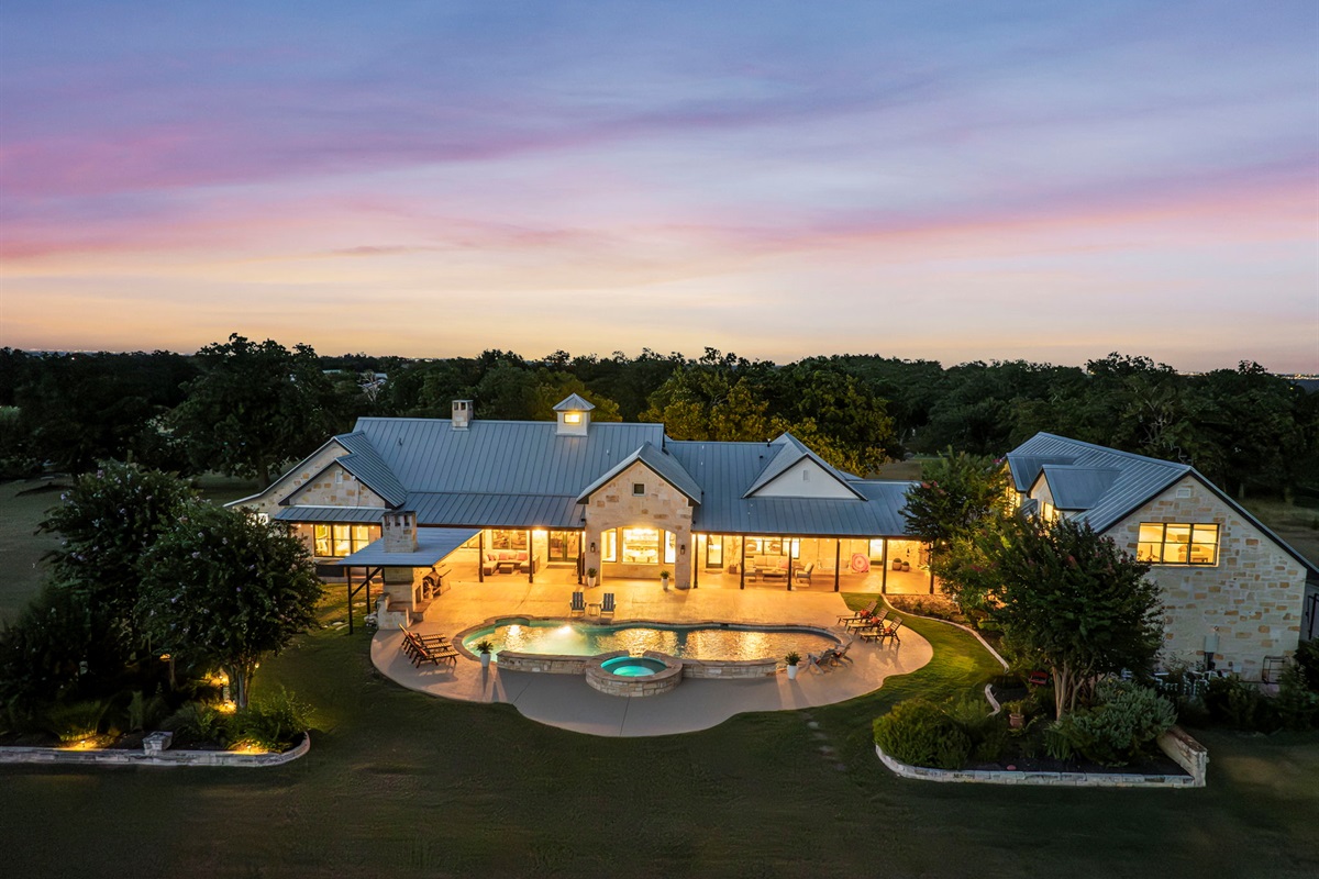 Aerial view at dusk, with glowing lights creating a peaceful twilight ambiance.