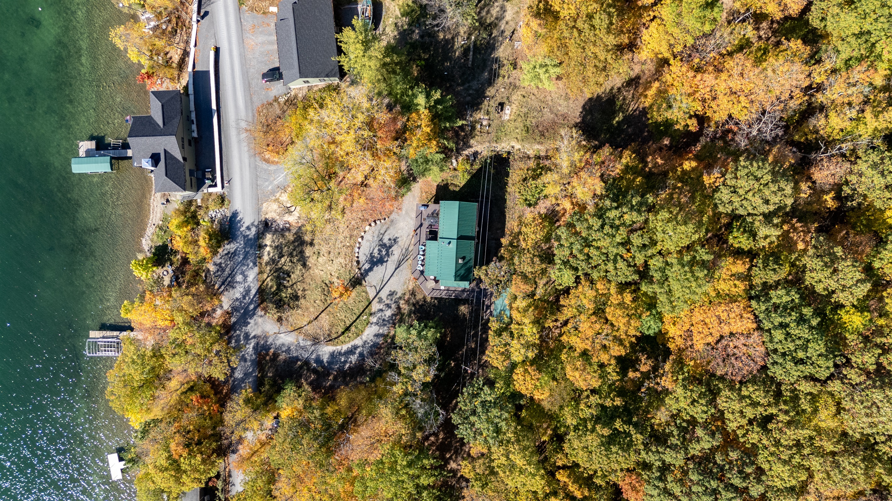 Driveway arrival at the cabin, nestled in vibrant fall foliage on Keuka’s serene shore