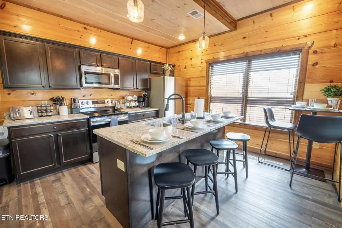 Cook like you're at home in the fully equipped kitchen at Marigold Cabin in Pigeon Forge, Tennessee. Stocked with modern appliances, full cookware, and everything your group needs to prepare meals during your Smoky Mountains vacation. A home-cooked breakfa