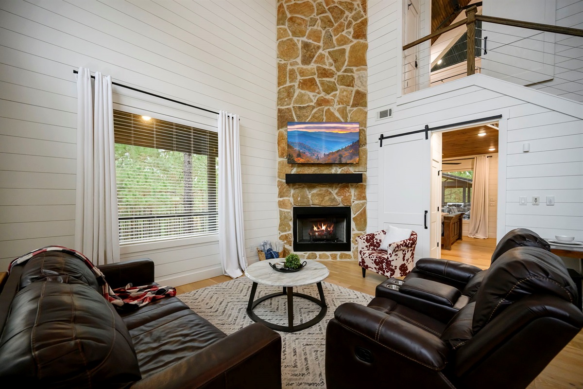Fireside living with cozy seating and queen sleeper🔥