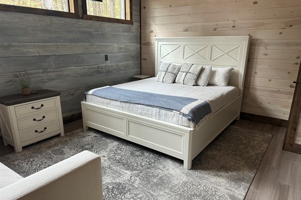 Spacious and versatile, this bedroom features both a plush king bed and a cozy single bed — perfect for families, friends, or groups wanting to stay together without sacrificing comfort