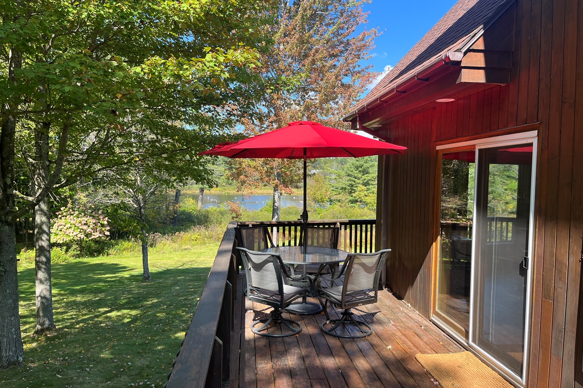 Sliders right off the kitchen lead to outdoor dining