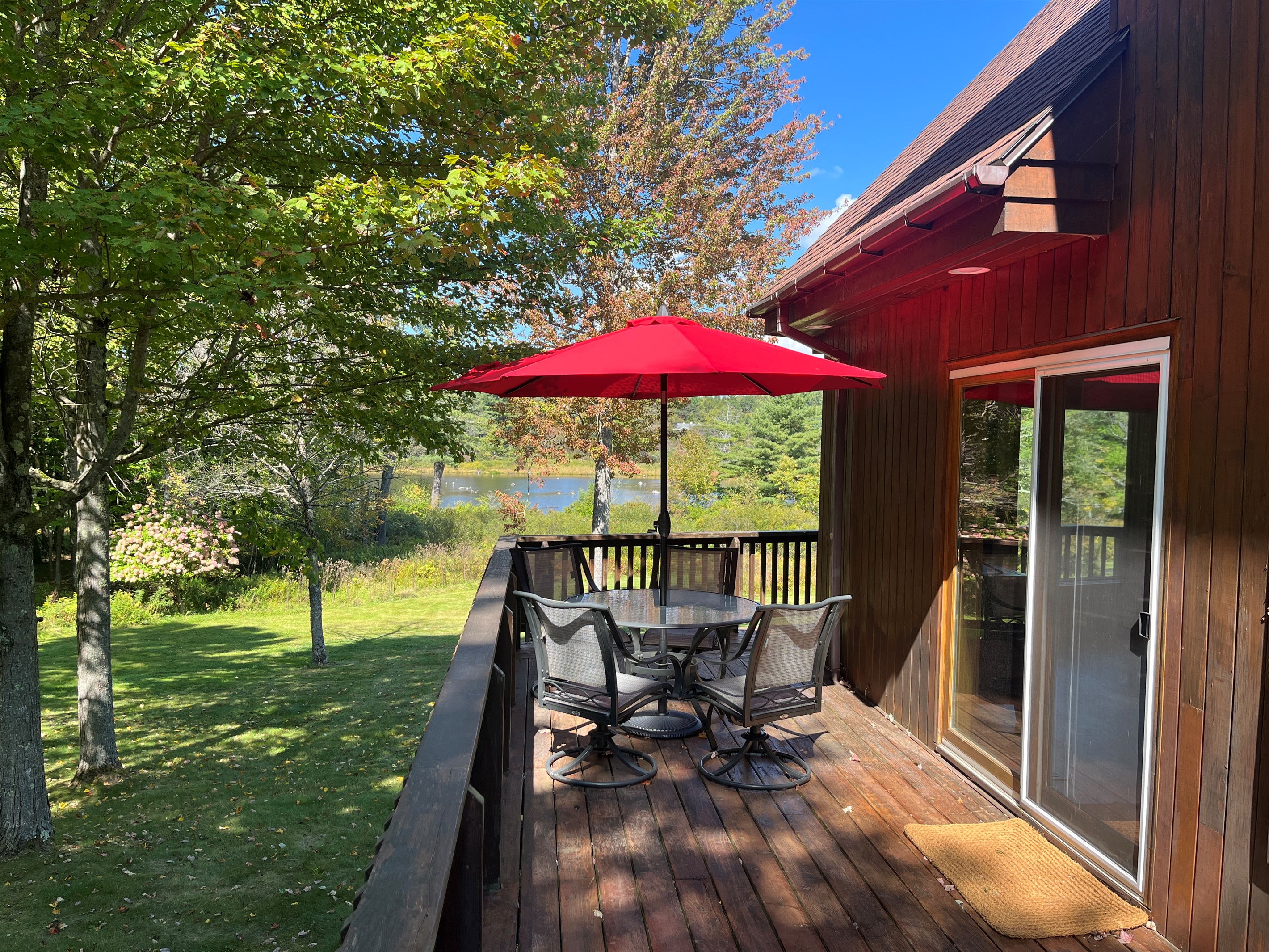 Sliders right off the kitchen lead to outdoor dining