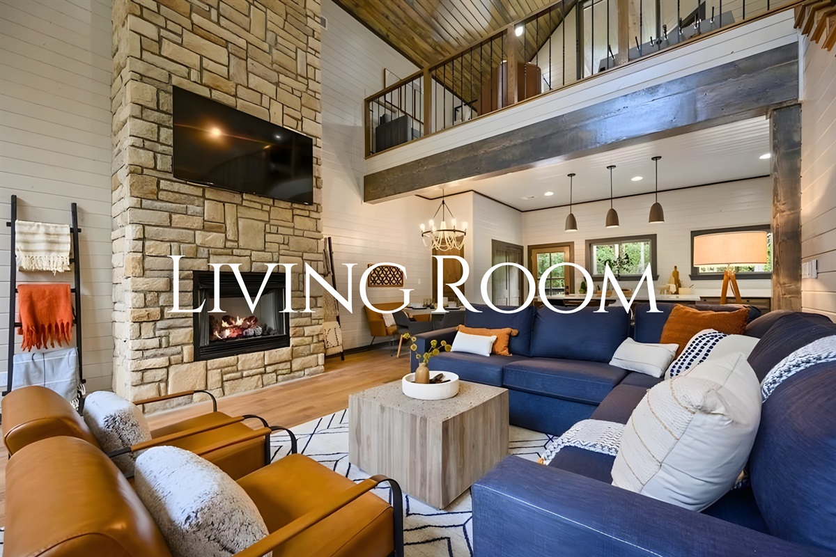 Designed for connection, the living room offers plush seating and a cozy fireplace that makes movie nights feel extra special.