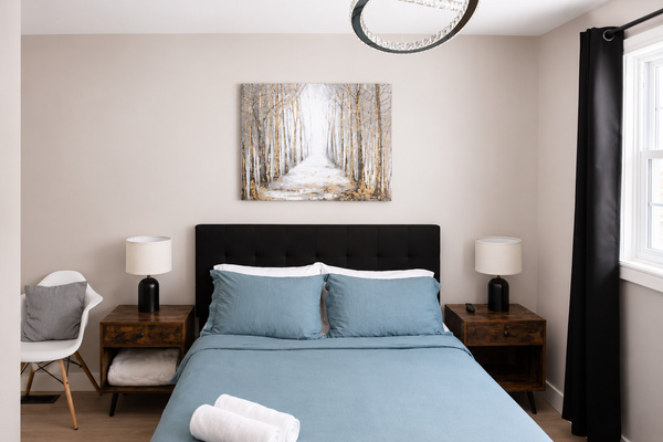 Bedroom 2: your quiet retreat with TV, dresser, closet, chair, USB lamps, electric fireplace and 2 plush robes for cozy nights in or a trip to the hot tub.