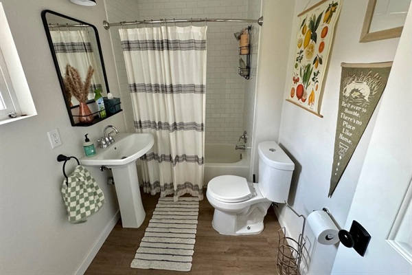 This bathroom off the main floor features a full shower and bath. 