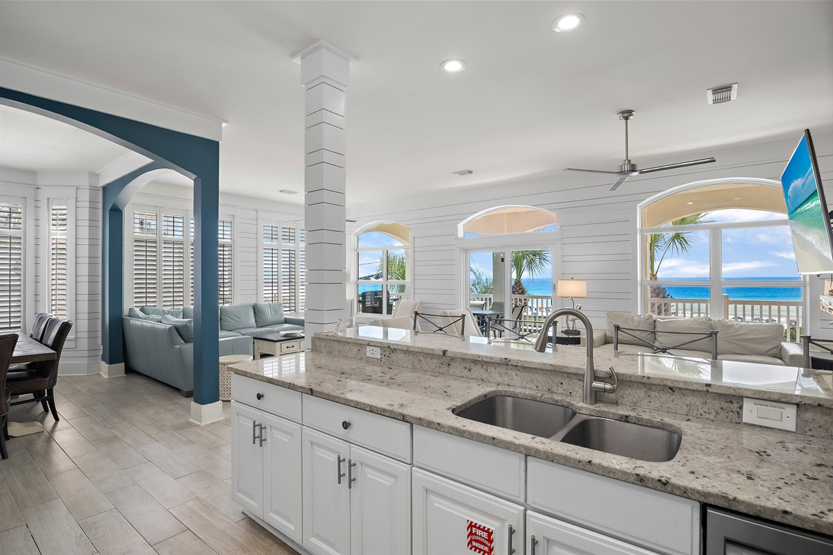 Remodeled Kitchen with granite countertops, stainless appliances - cook delicious meals and dine while overlooking the Gulf of Mexico!