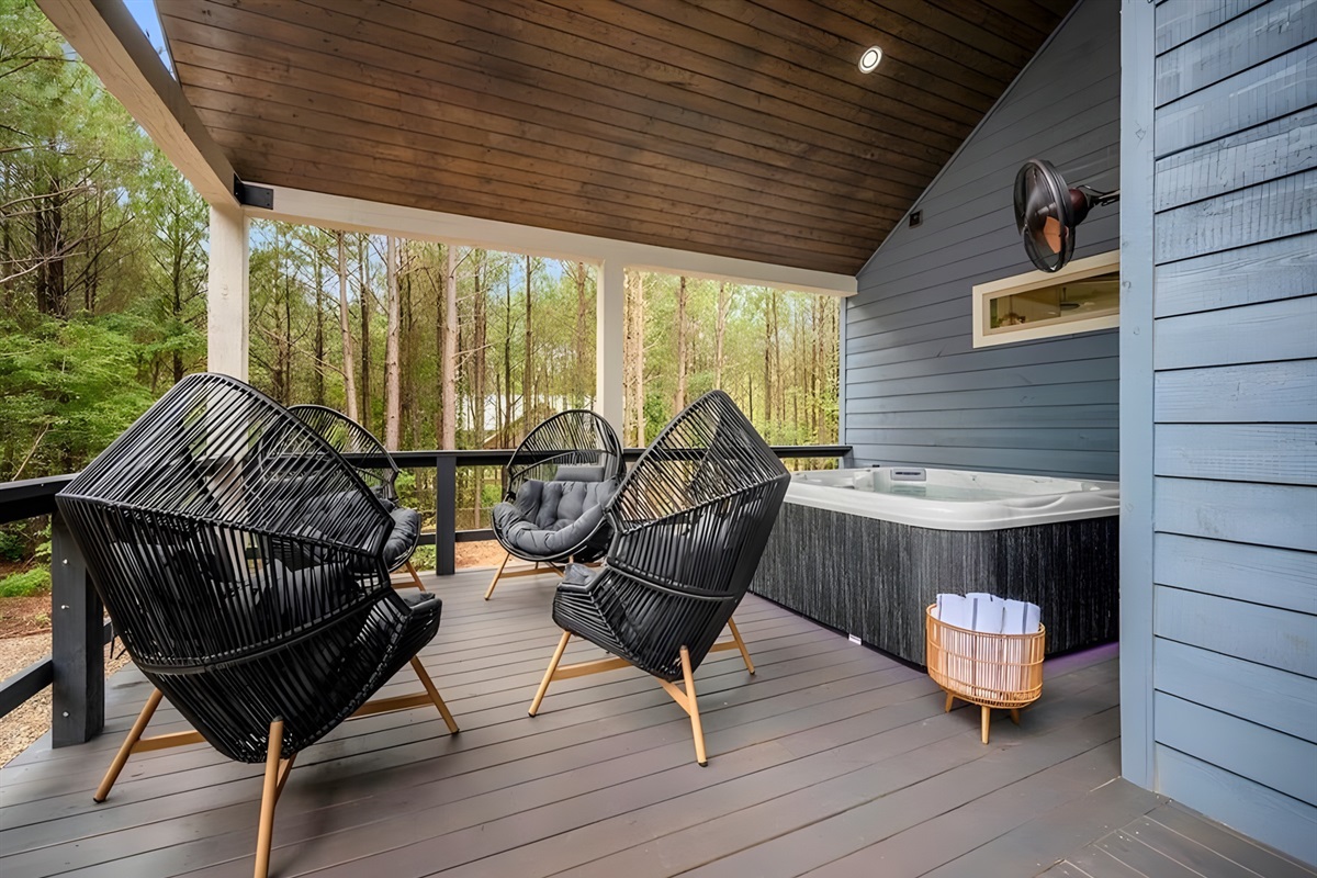 With cozy chairs and a shaded deck, this outdoor space makes relaxing feel effortless.