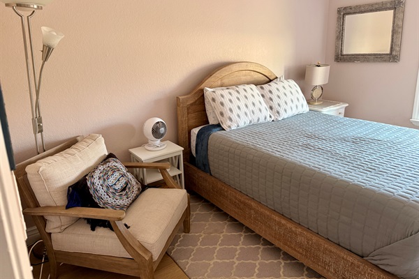Second bedroom with comfy memory foam queen sized mattress. Super cozy chair great to curl up on with a good read.