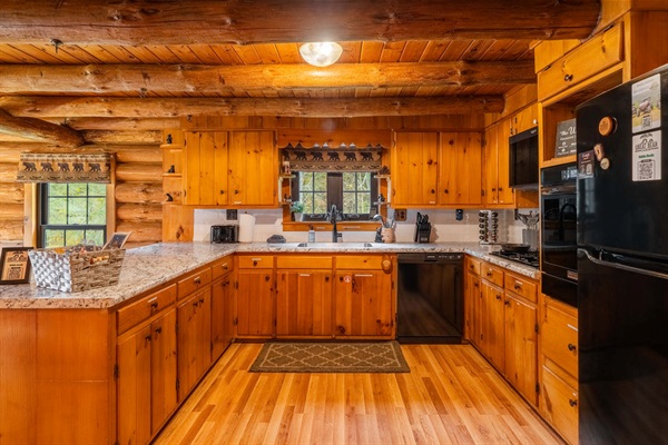 Fully stocked and full of charm—our rustic kitchen makes it easy to cook up family meals, morning pancakes, or a pot of cocoa after a day in the great outdoors.