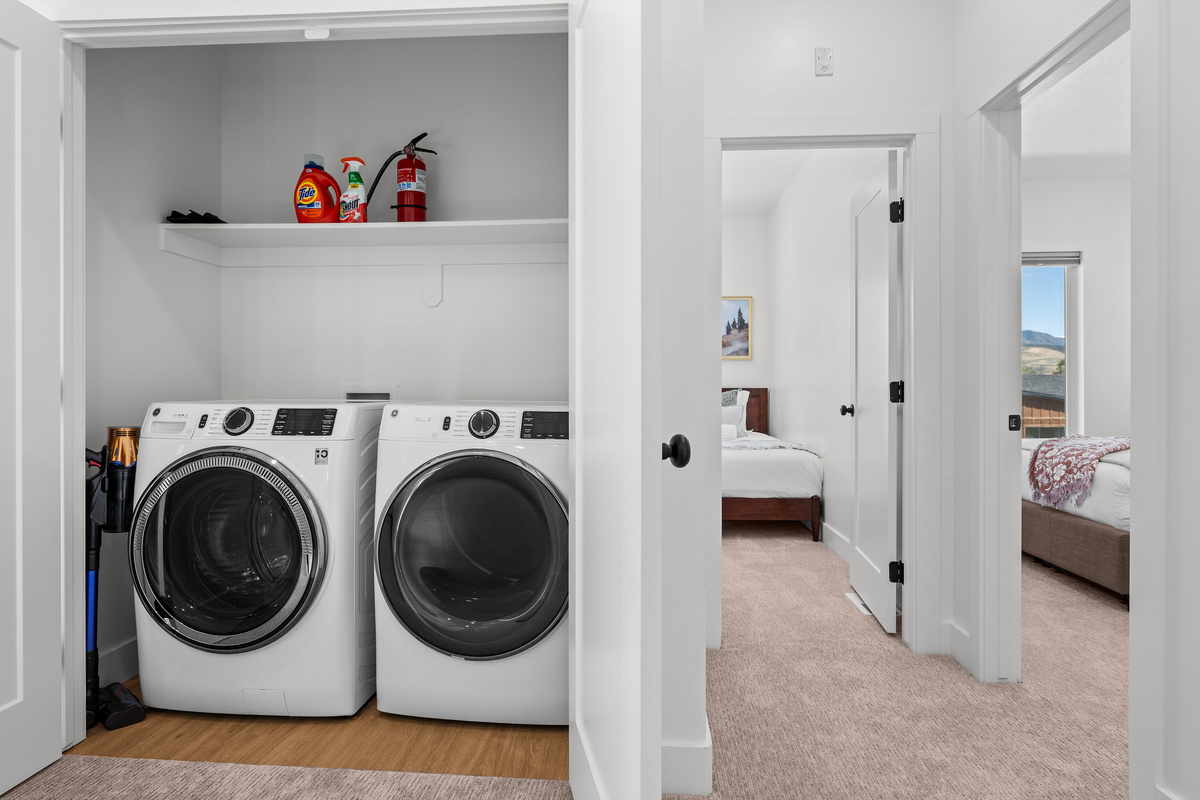 A dedicated laundry area with full-size washer and dryer makes longer stays especially convenient.