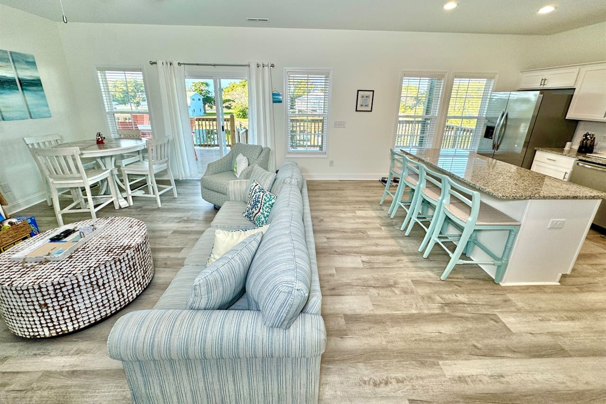 Get cozy while you relax in this living room with a fireplace and water view. Sofa bed features a Queen mattress. 