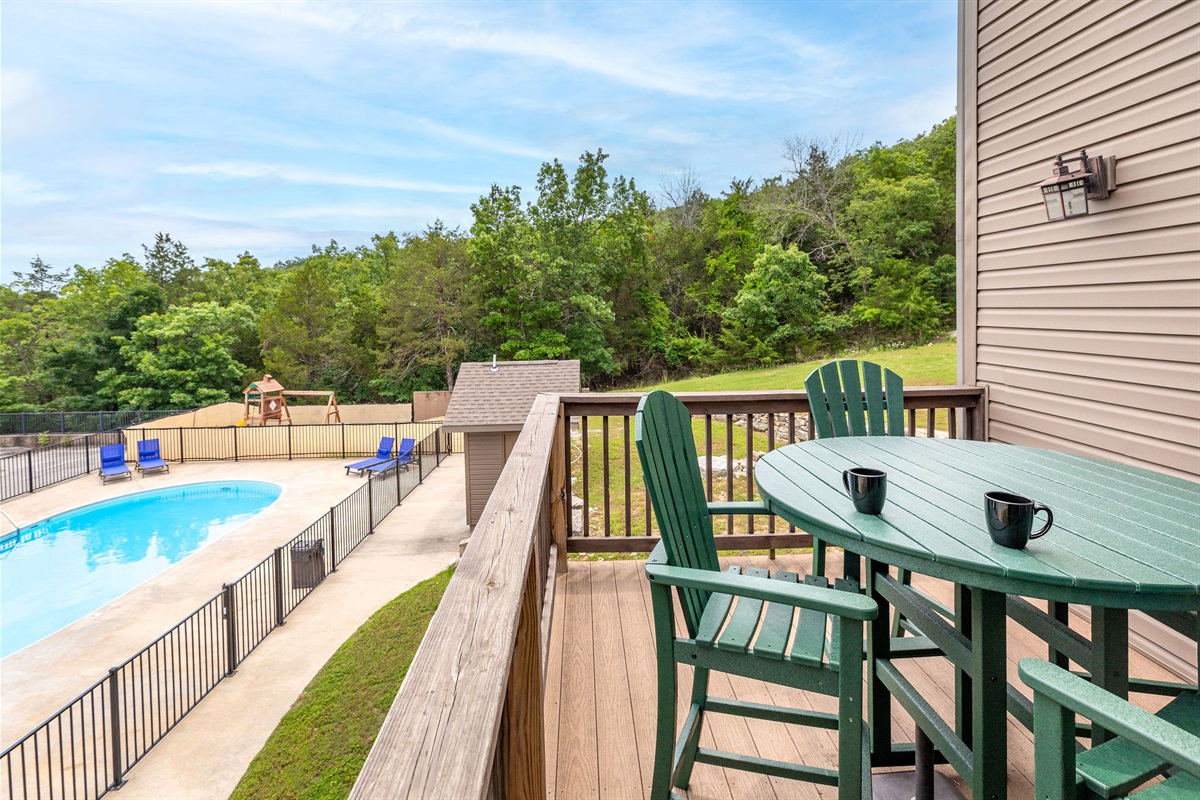Relax on the back deck while watching your family in the pool!