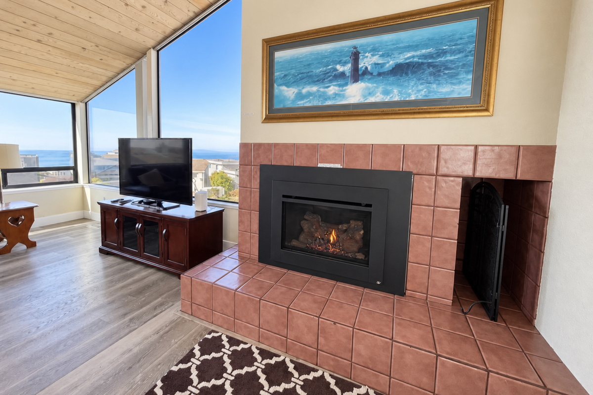 Living Room with propane fireplace; Large HDTV with Roku/cable