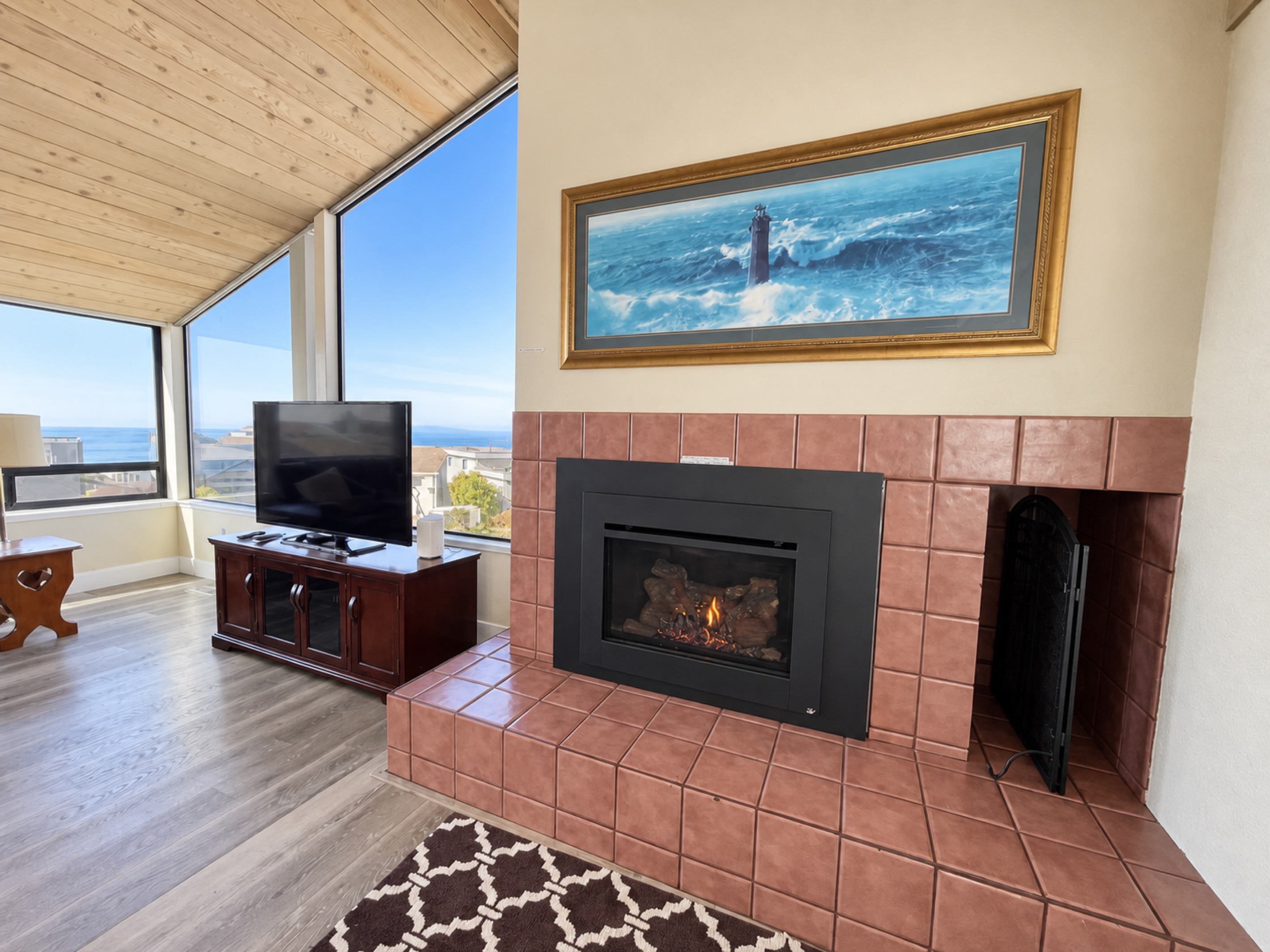 Living Room with propane fireplace; Large HDTV with Roku/cable