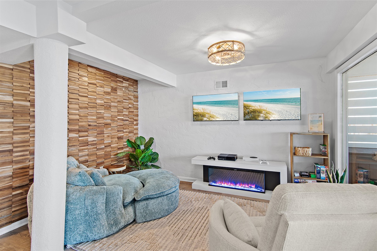Green Reef 1 - Downstairs living space with comfortable seating, Xbox, Two TVs, electric fireplace, and Gulf Views!