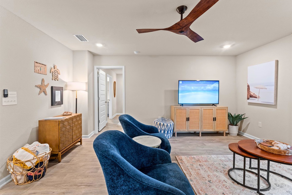 Another view of the living area highlights the open layout and comfortable setup designed for easy downtime.