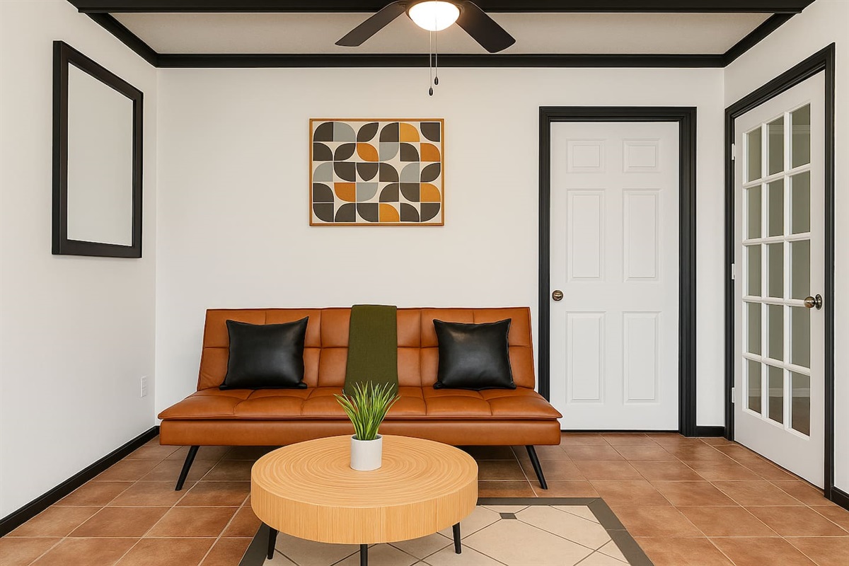 A modern yet inviting space, this living room features clean design and comfortable seating — perfect for relaxing or catching up with loved ones. 