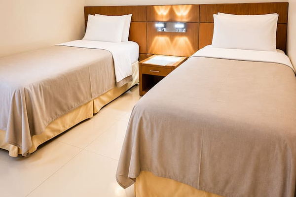 Two single beds perfect for kids or groups or friends sharing. 