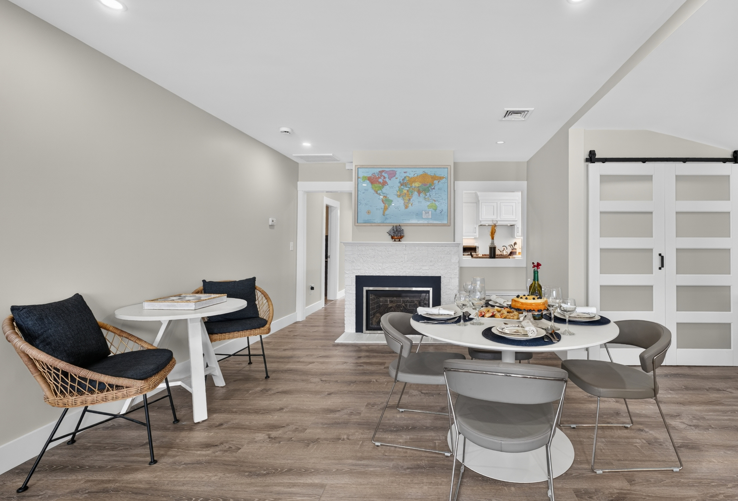 Modern dining area with stylish seating, fireplace, and open flow into the living space.