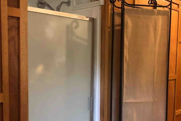 The shower provides endless hot water with our new tankless water heater.  Since the shower is not enclosed, guests should be limited to 2-3 very close friends.  