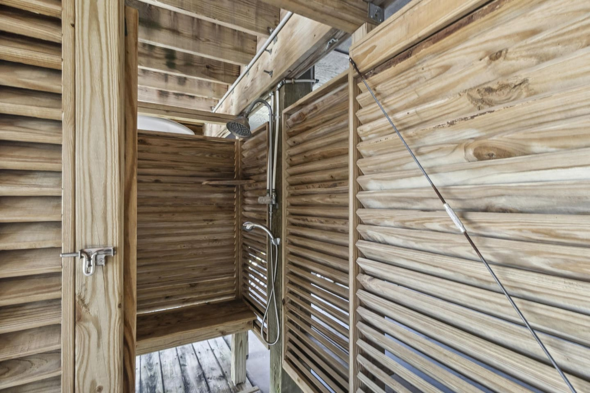 Rinse the Gulf sand off in the enclosed outdoor shower before heading back inside for dinner.