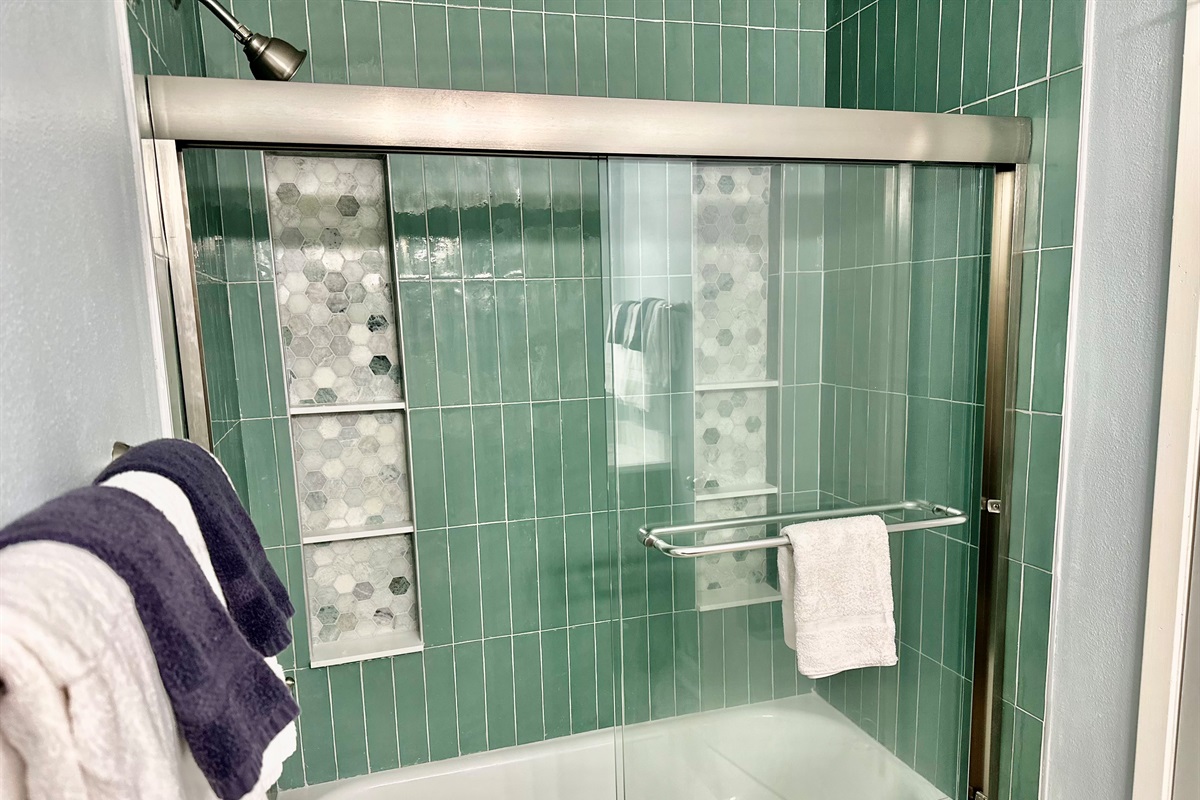 Lovely renovation of the guest bathroom!  New tile in the tub/shower combo!