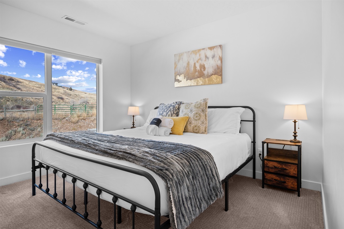Primary upstairs bedroom with king bed and beautiful mountain views.