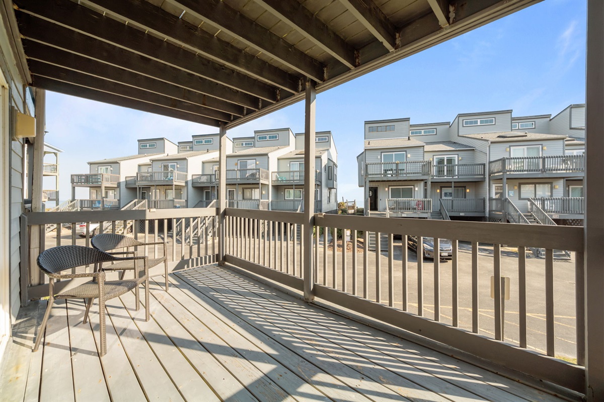 Another angle of the covered deck showing the open layout and breezy coastal setting