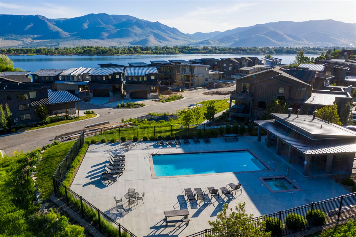 Resort-style pool and hot tub surrounded by stunning mountain scenery