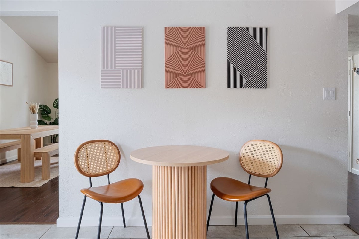 Enjoy a peaceful lunch in this compact eating area, which is accented with modern wall art. The setting is ideal for casual meals or a quick snack.