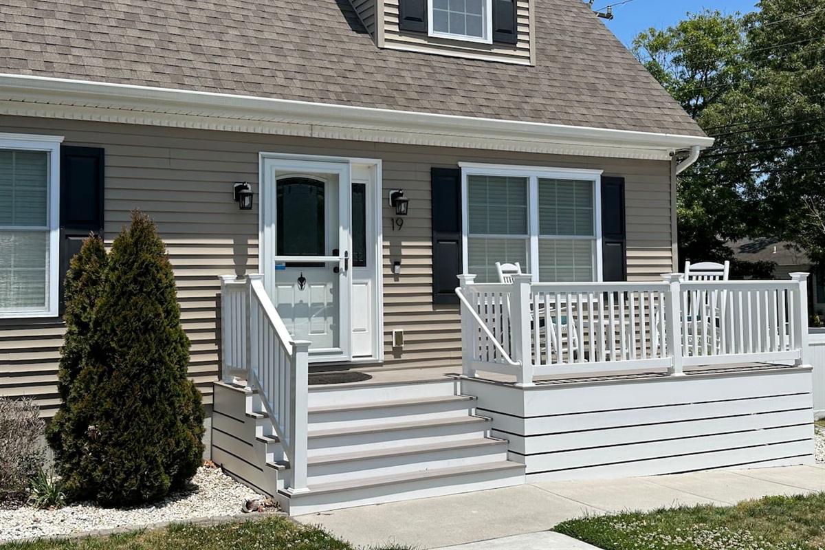 Welcome to the house! This front porch is the perfect spot for morning coffee. It’s such a bright, cheery entrance, and the rocking chairs are just waiting for you to sit back and watch the world go by.