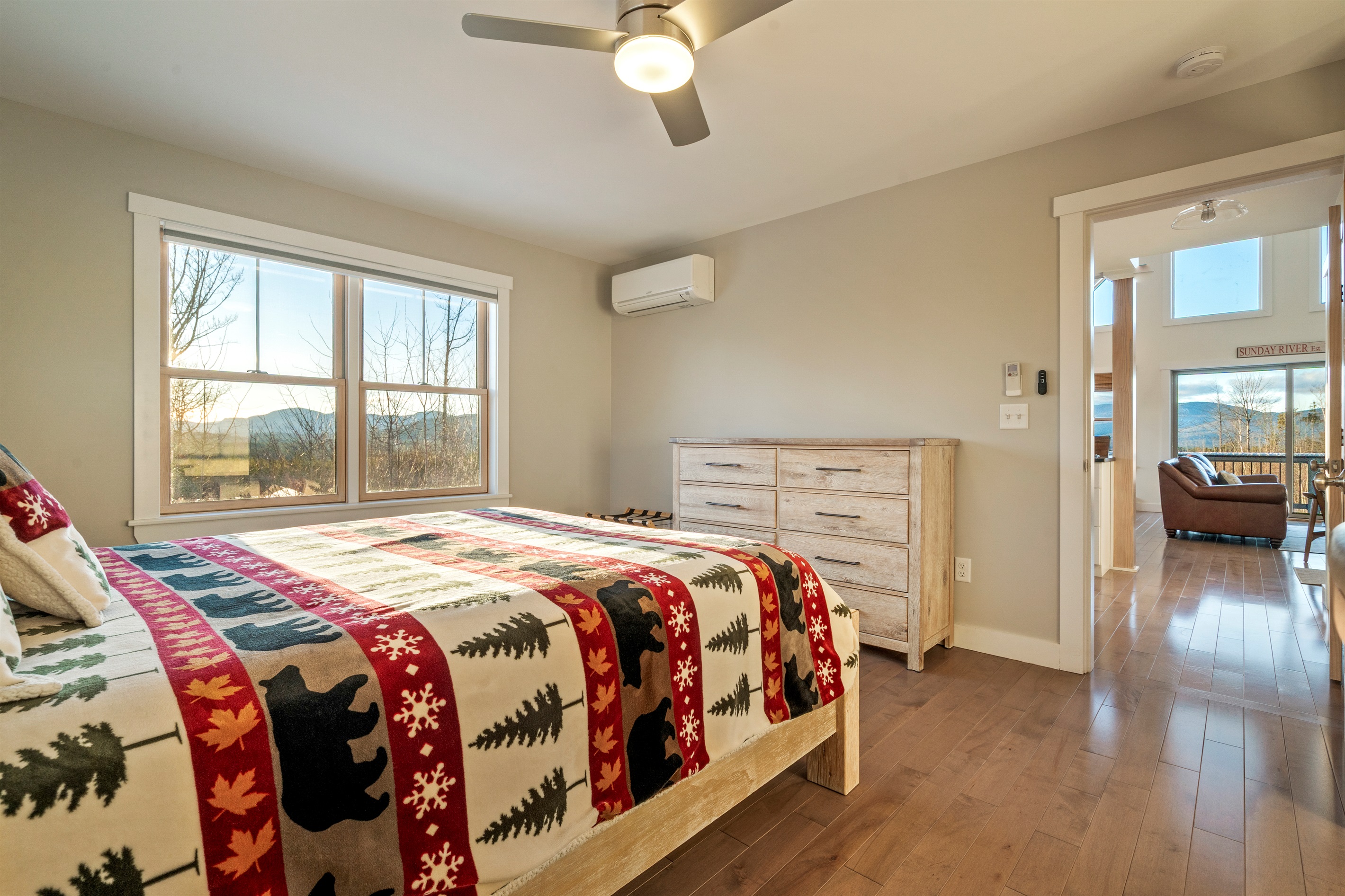Relax in a queen bedroom with a table and chair workspace