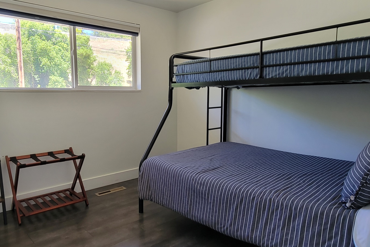 Bunk beds in third bed, full size bottom with a twin on top.