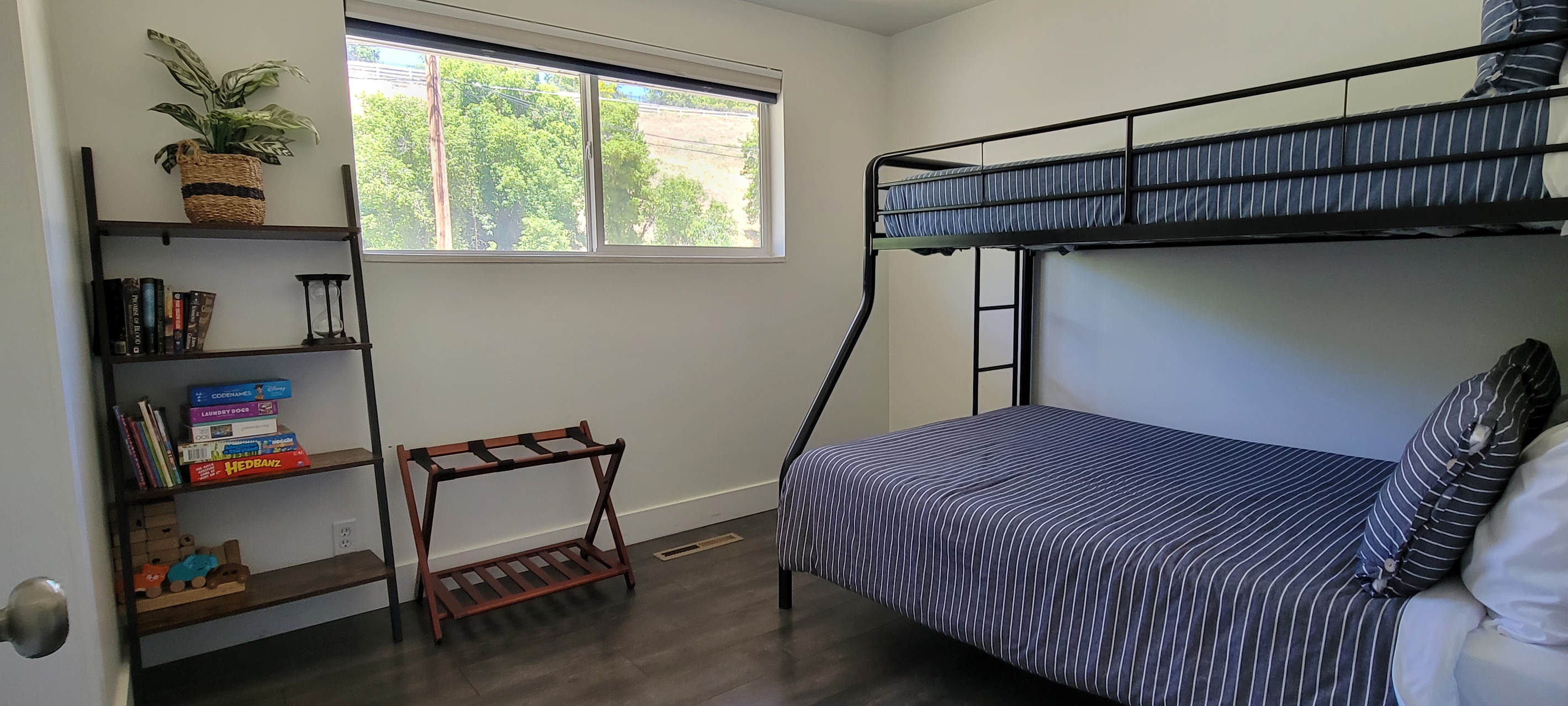 Bunk beds in third bed, full size bottom with a twin on top.