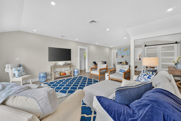 Comfortable living area with plush seating, large TV, and an open layout perfect for relaxing together.