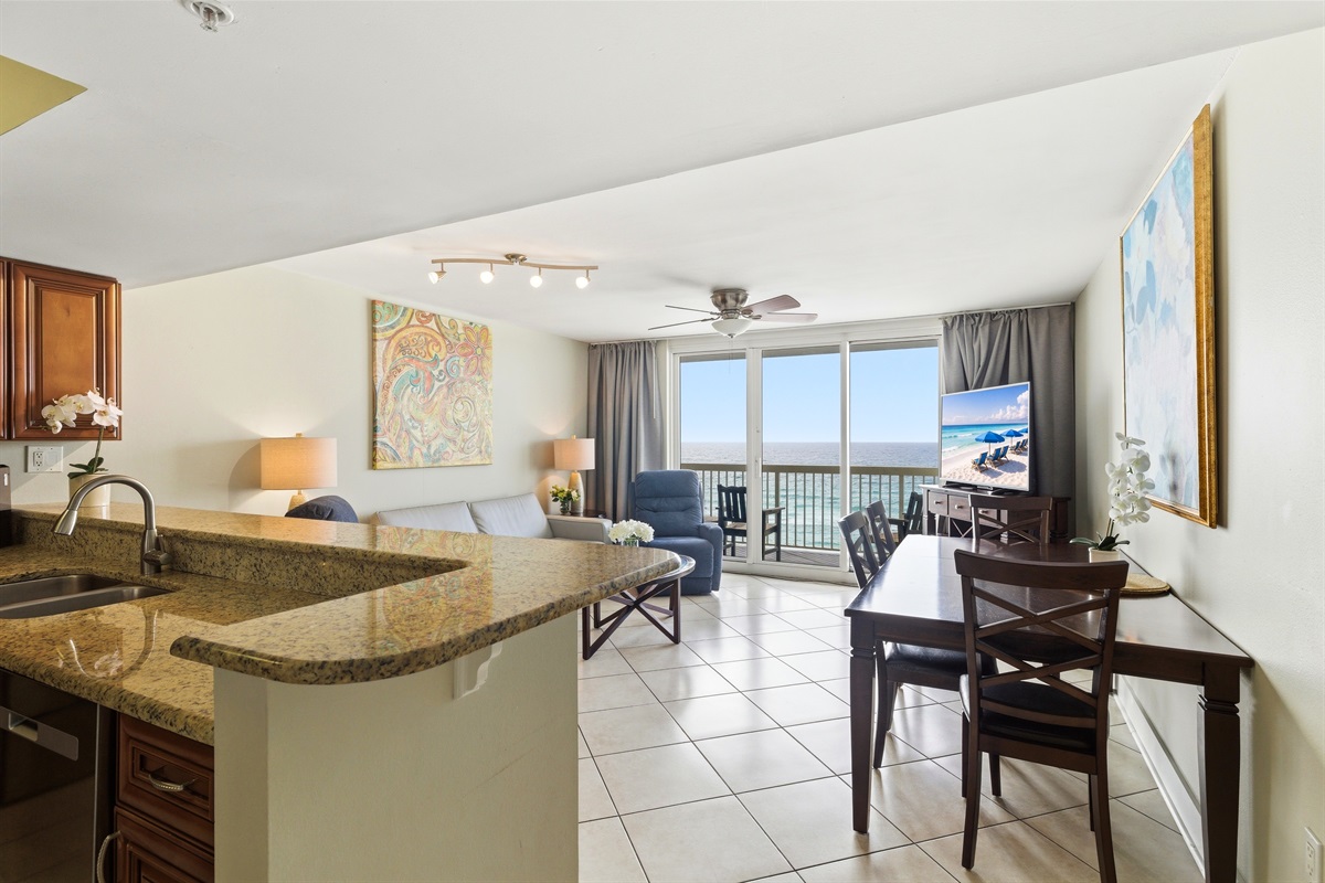 All you need from a living room, comfy recliners, couch and dining place and few steps to kitchen...